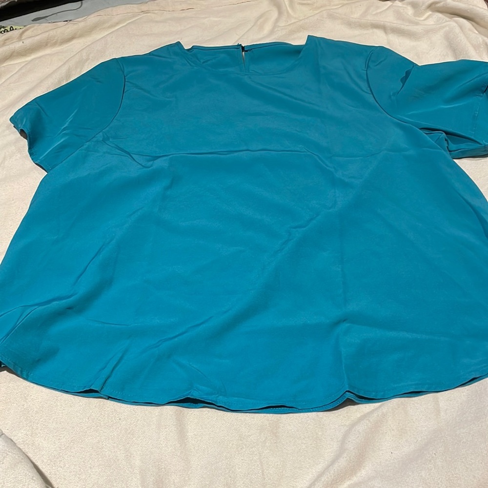 Teal blouse with a keyhole back.